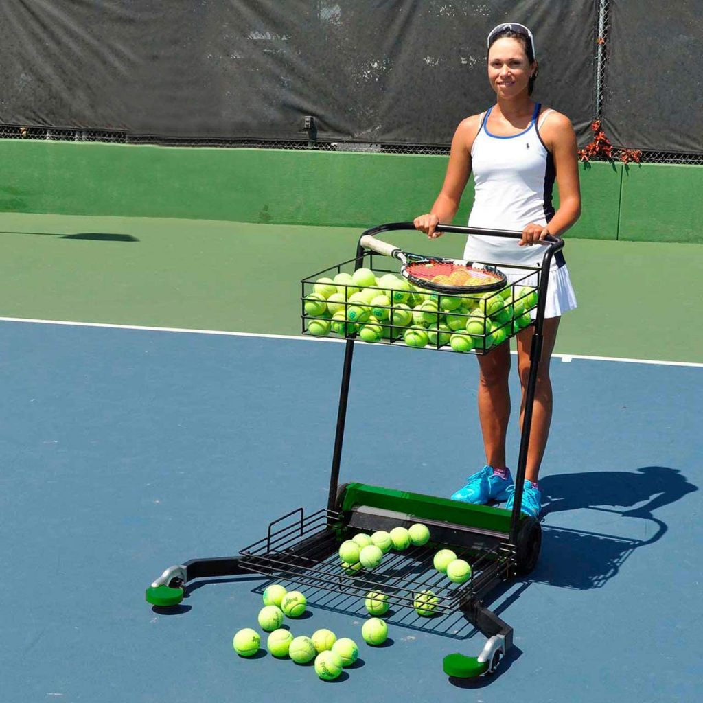 A woman holding the Tennis Multimower as it is the Best Tennis Ball Mower